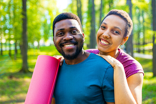 Couple with yoga mat