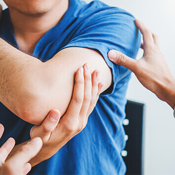 Person stretching their shoulder